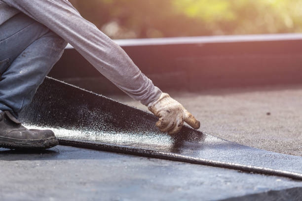 Professional Waterproofing technician working in Farmersville Station, NY